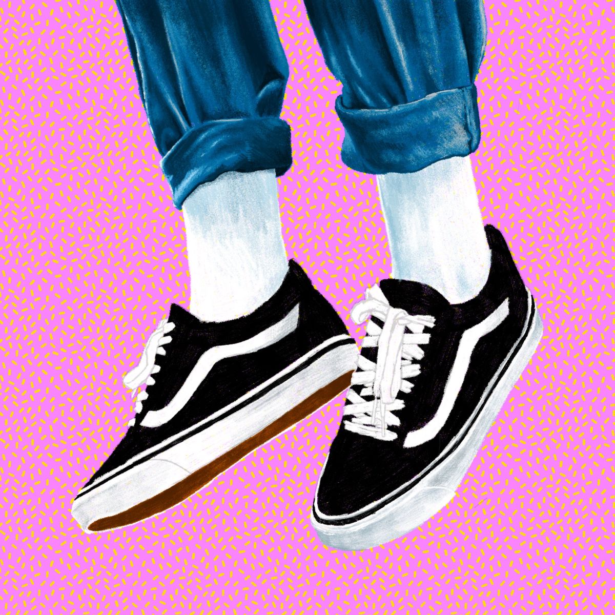Black and white Vans trainers with white socks and jeans, cropped just below the knees